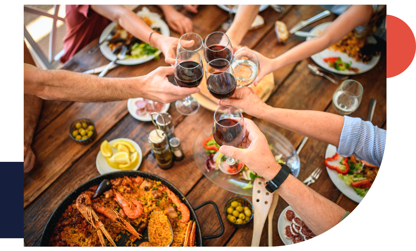 People eating paella and drinking wine