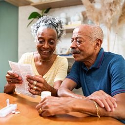 Senior couple reviewing medication