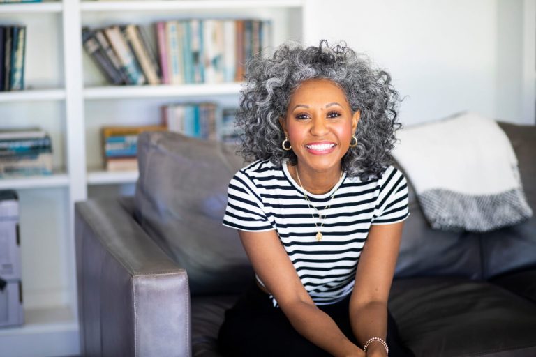 Black woman with curly grey hairstyle