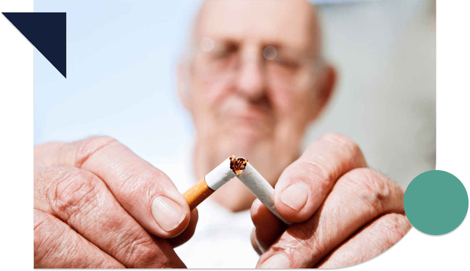 Older man breaking a cigarette in half