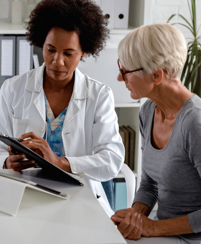 Female doctor with elderly patient