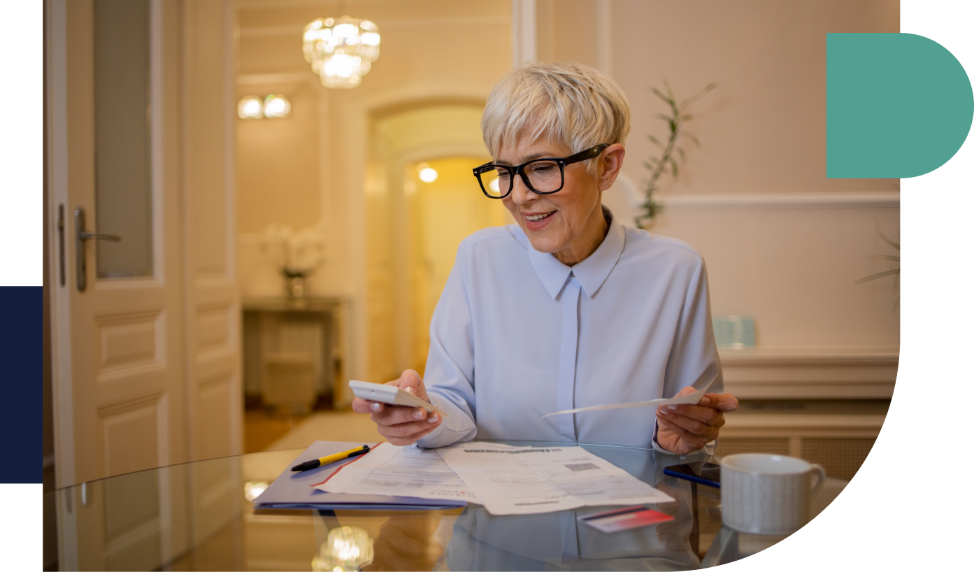 Businesswoman at desk going through documents