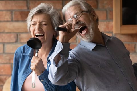 A couple of seniors singing karaoke