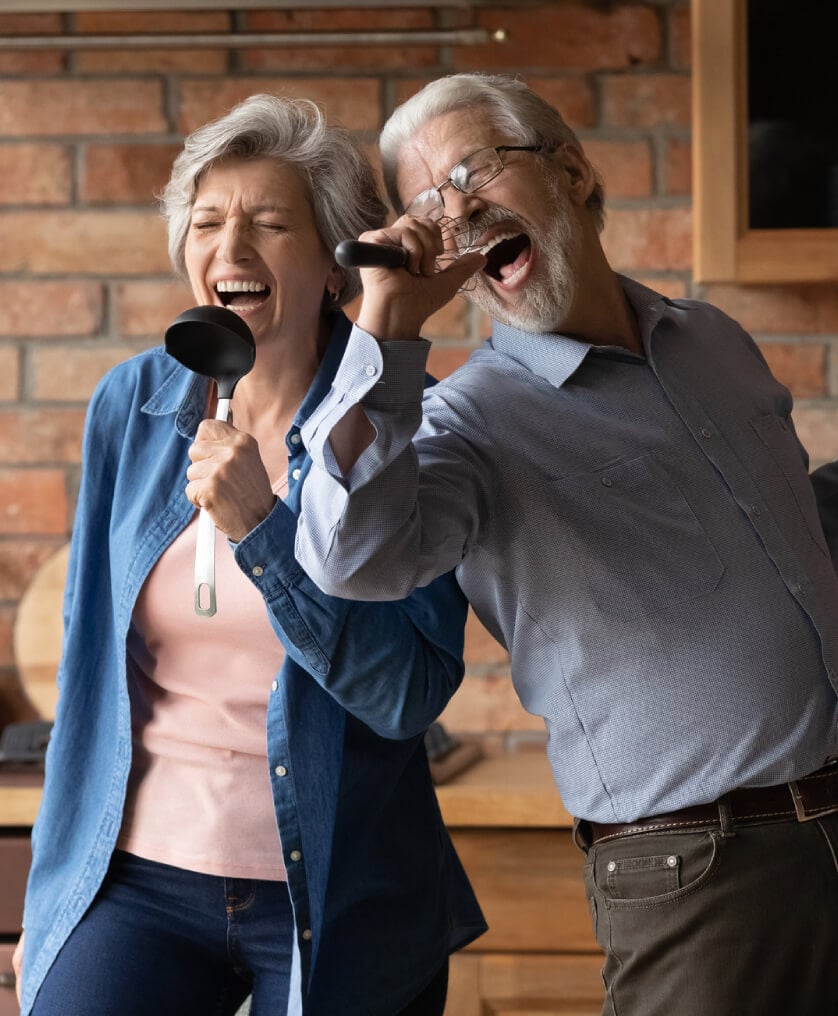 A couple of seniors singing karaoke