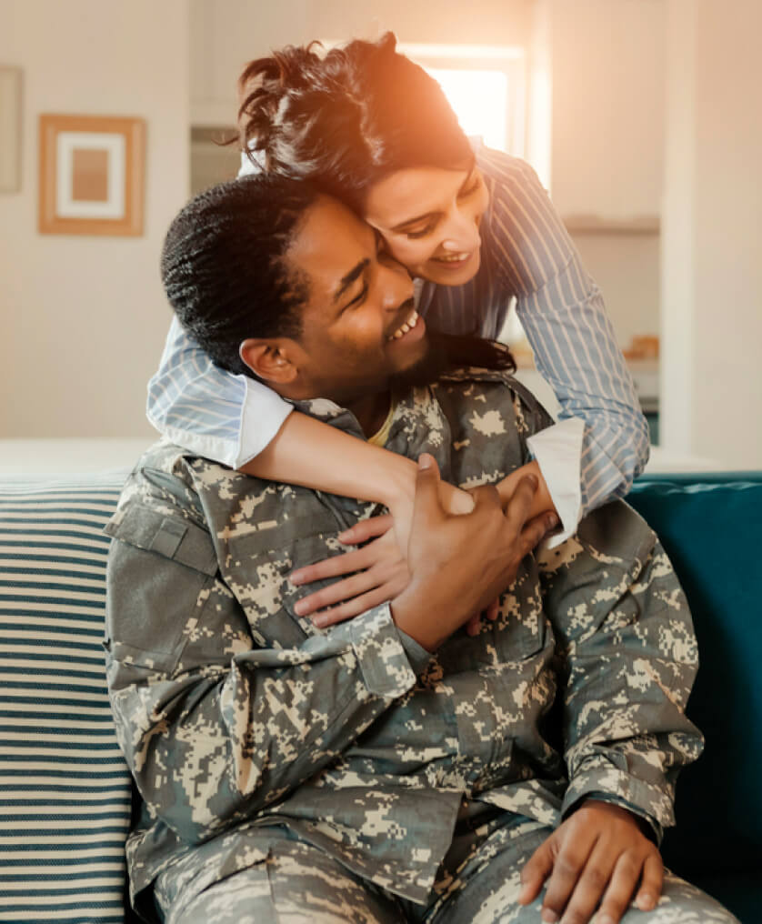 Woman hugging her veteran spouse