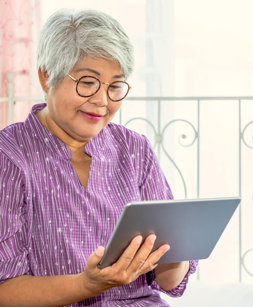 Woman signing up for Medicare on her iPad