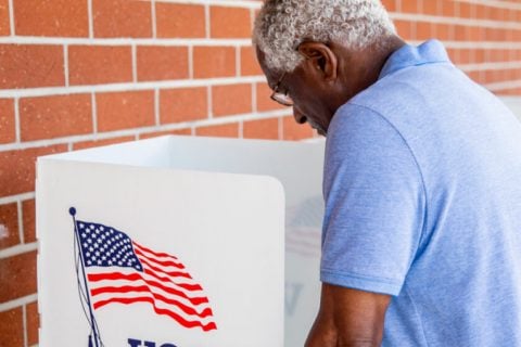Elderly man at the voting booth