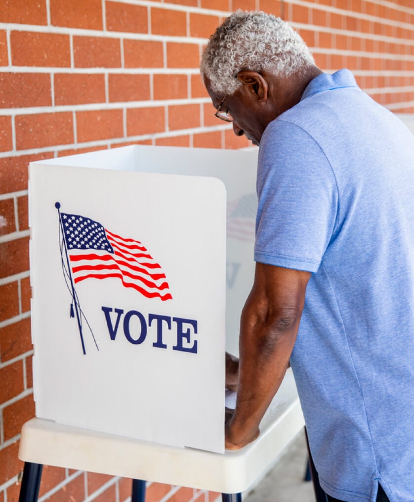 Elderly man at the voting booth