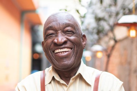 Hero elderly black man smiling