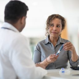 Woman and doctor discuss diabetes