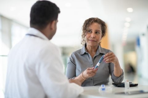 Woman and doctor discuss diabetes