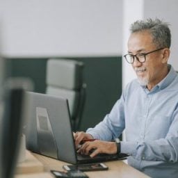 Man working on computer in office