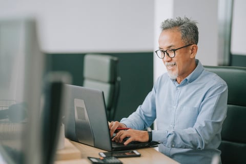 Man working on computer in office