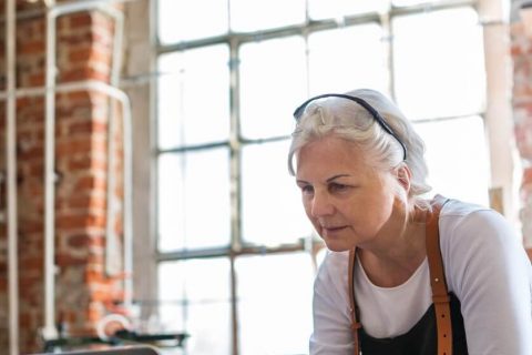 Older woman at work on her laptop