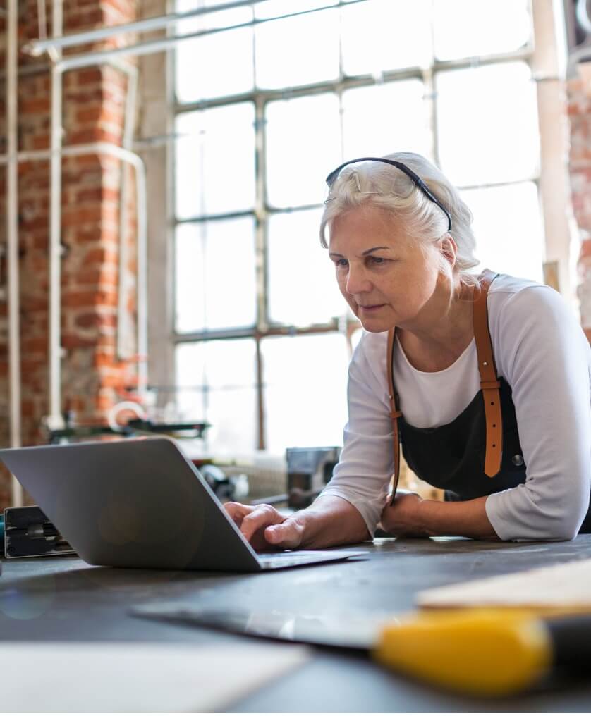 Older woman at work on her laptop