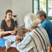 Medicare advisor helping older couple
