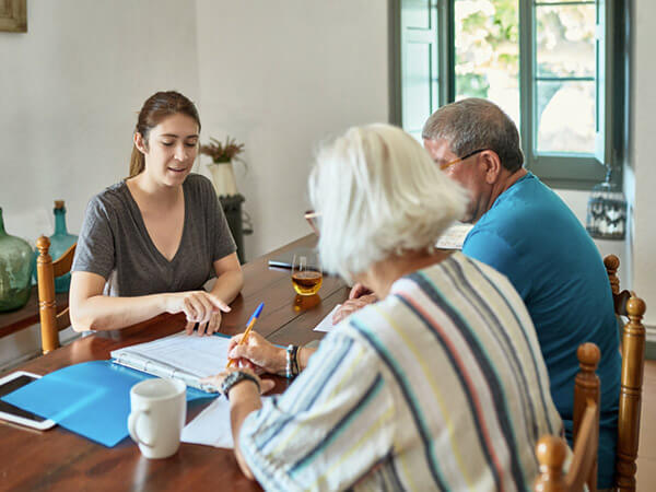 Medicare advisor helping older couple