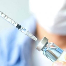 Needle removing insulin from vial