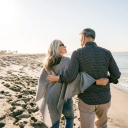 Older couple walking along the beach