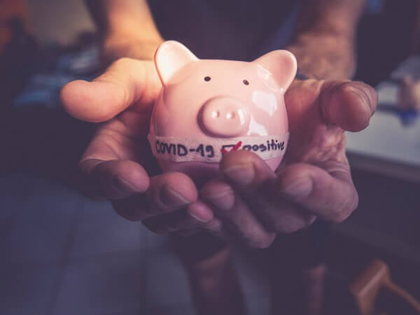 Person holding piggy bank