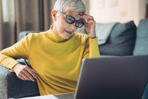 Older woman struggling to use a website
