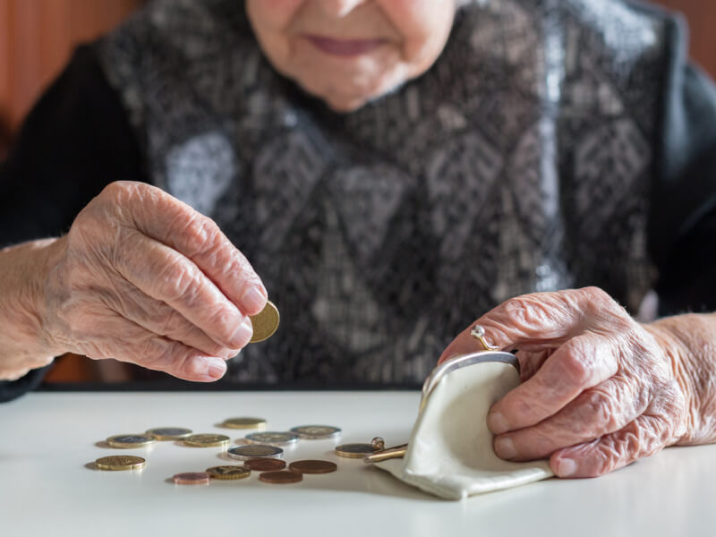 older woman counting coins