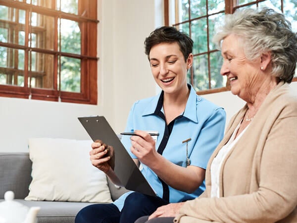 Young woman surveying older woman