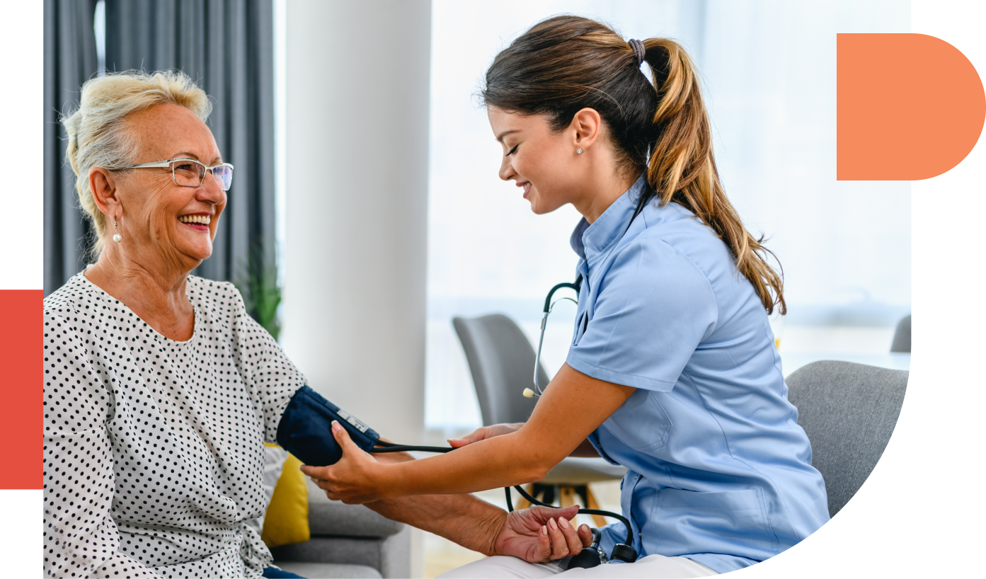 Nurse measuring blood pressure of senior women at checkup meeting