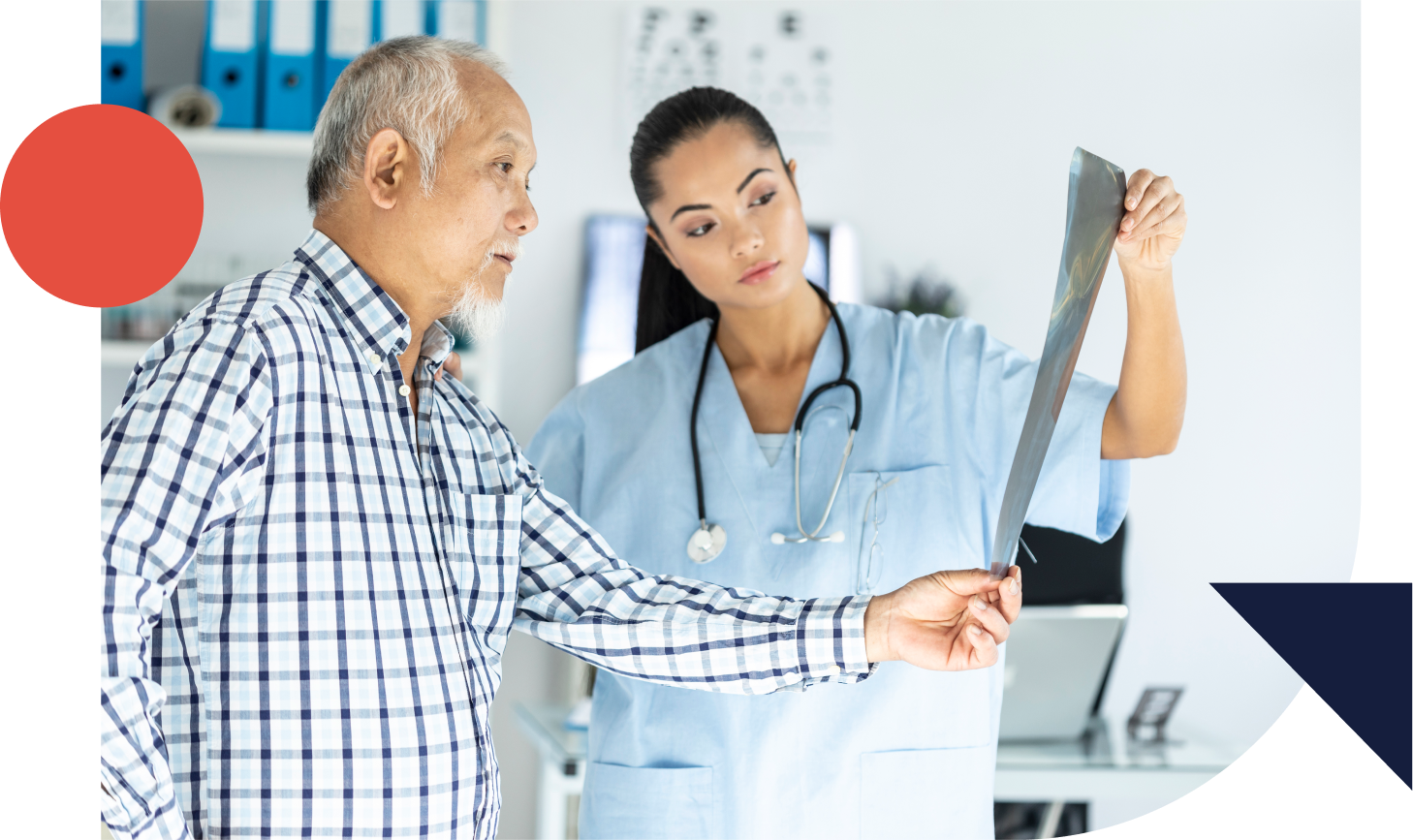 Older adult with young woman doctor looking at xray