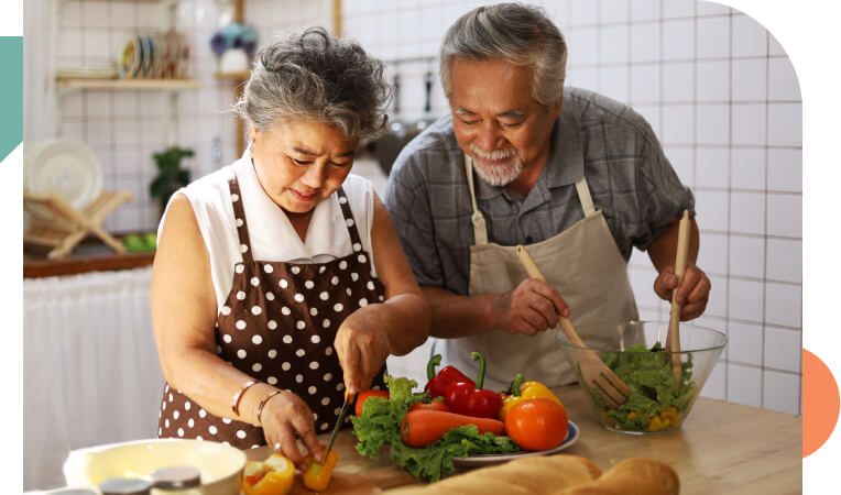 senior couple cooking food