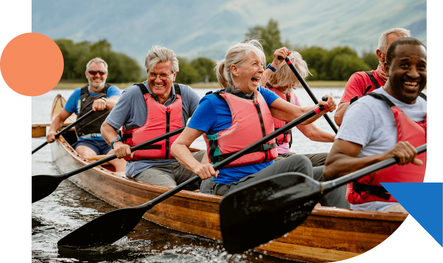 Smiling seniors out rowing a boat on the lake