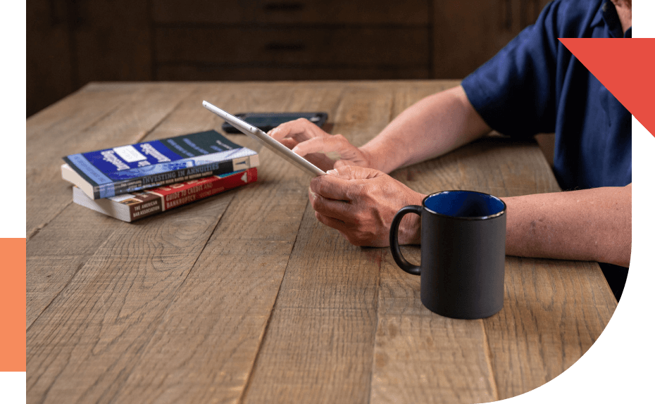 Man on ipad while having coffee