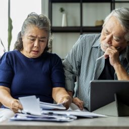 Senior couple reviewing paperwork together