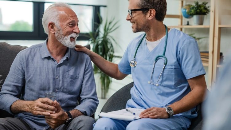 Older man and doctor talking