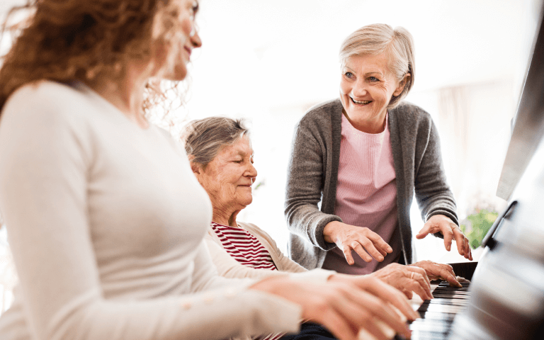 Seniors playing the piano