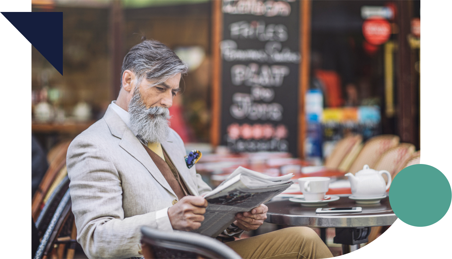 Well-dressed senior reading a newspaper at a cafe