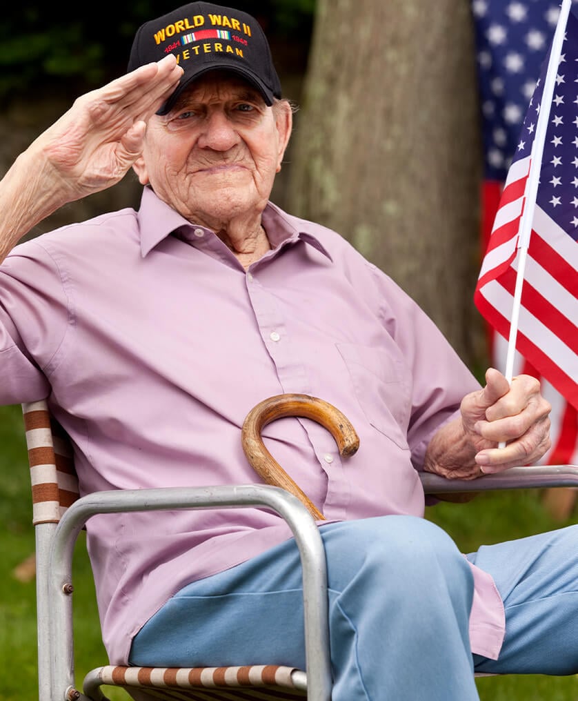 Veteran sitting with flag