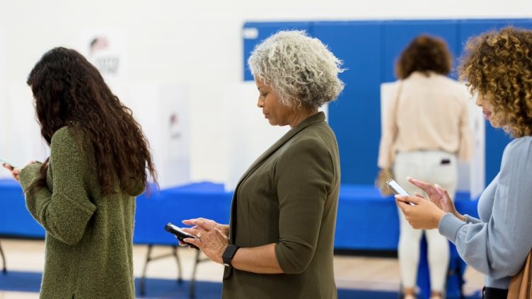 Women of varying ages standing in line